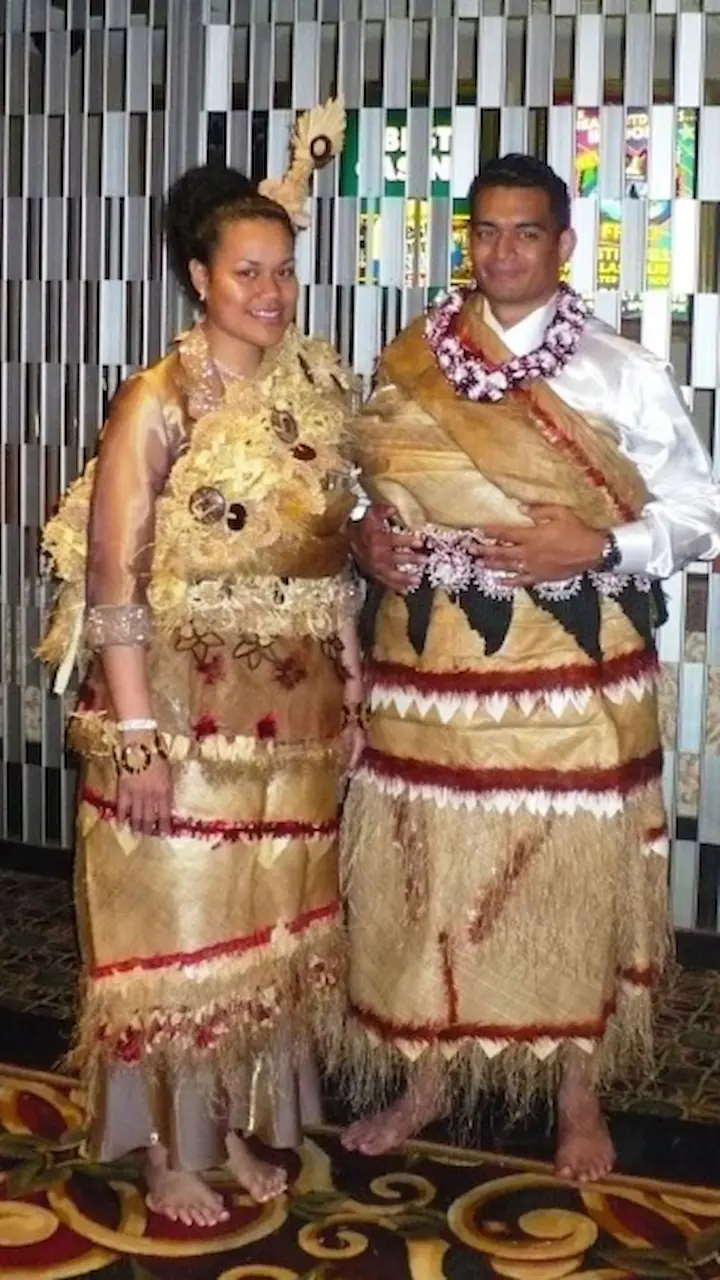 An engaged couple wearing taʻovala.