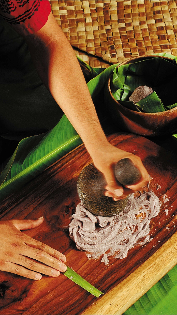 Close up of taro being pounded into poi