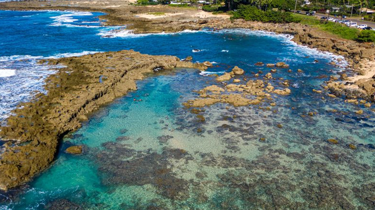 Aerial view of a blue lagoon and bay.