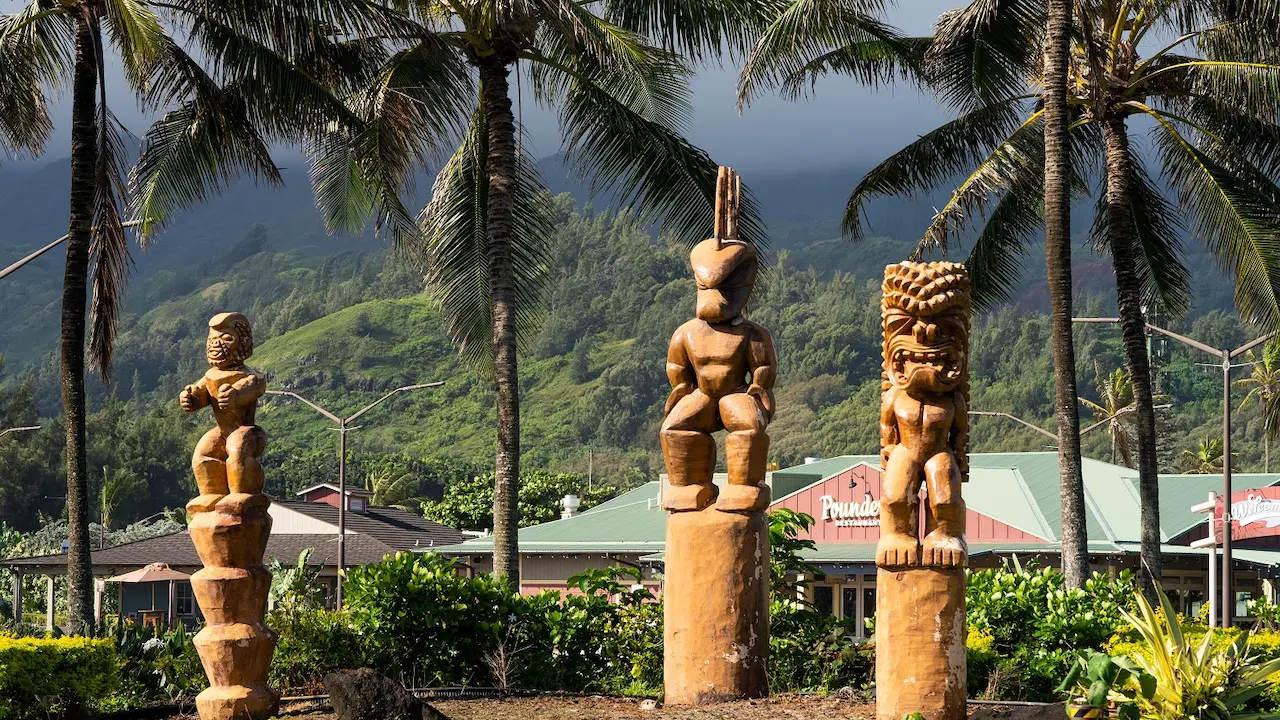Three giant tikis that are placed just outside the main entrance to the Polynesian Cultural Center.