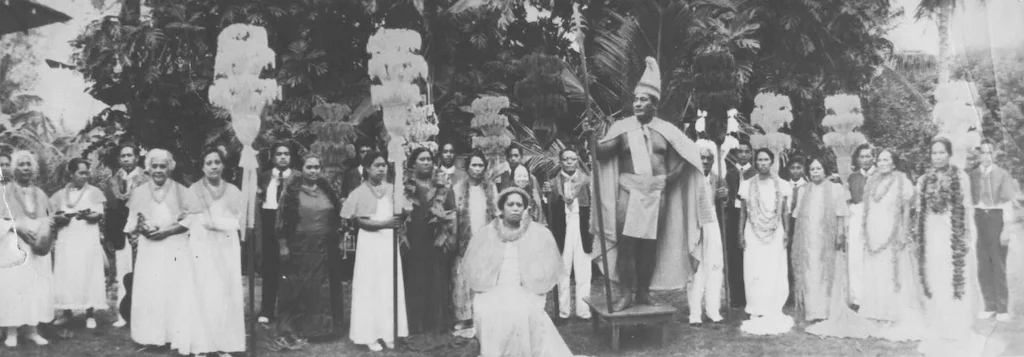 Photograph of Hamana Kalili and locals from Lāʻie portraying the royal court of King Kamehameha, with Kalili serving as the king.