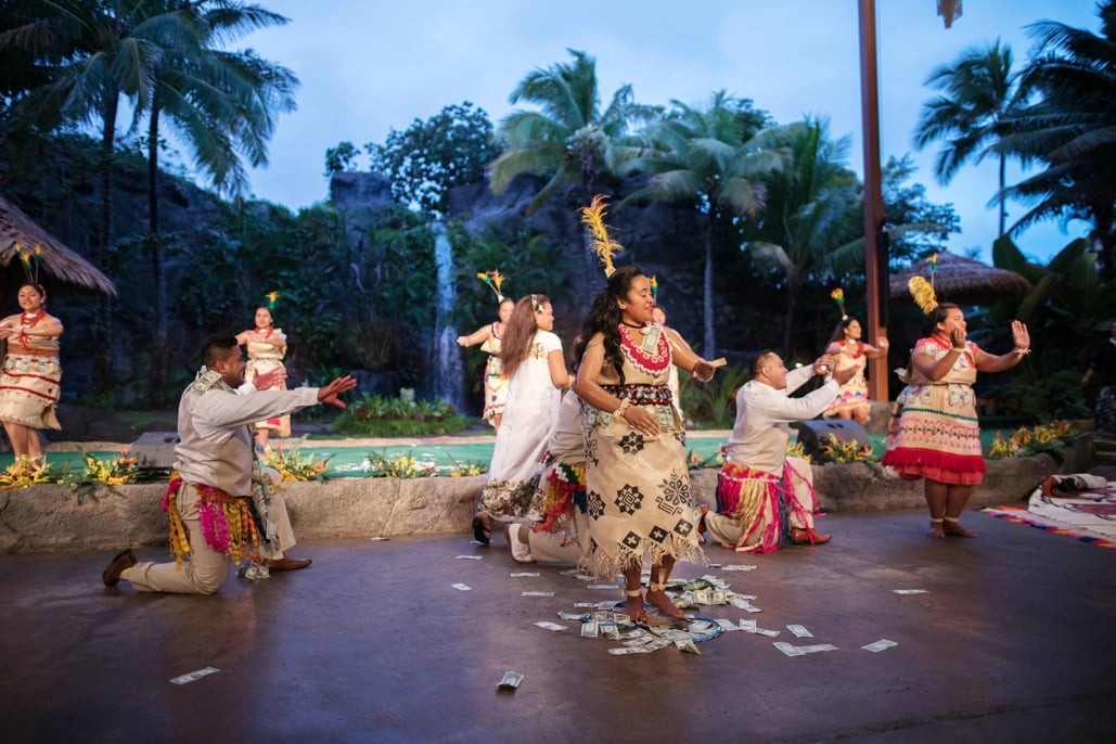 Tongan couple doing traditional Tongan dance during wedding ceremony
