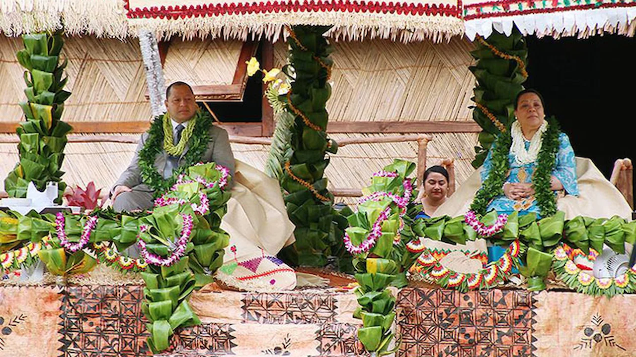 King and queen of Tonga attending a ceremony.