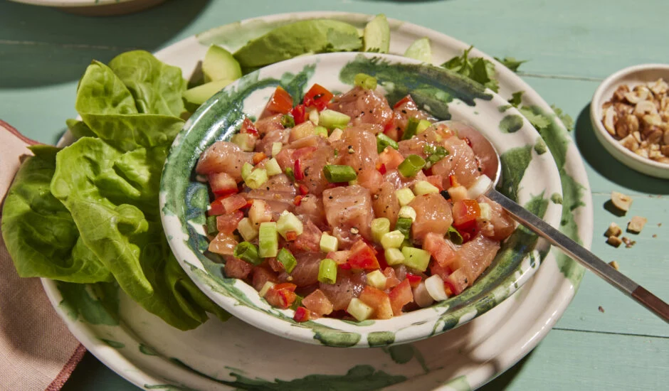 Bowl of lomi lomi salmon served with lettuce for wraps.