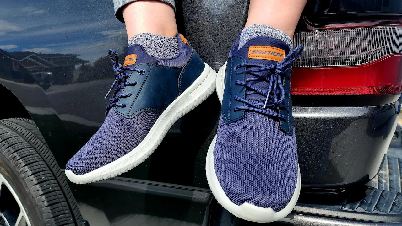 Blue lace-up athletic Sketchers sneakers