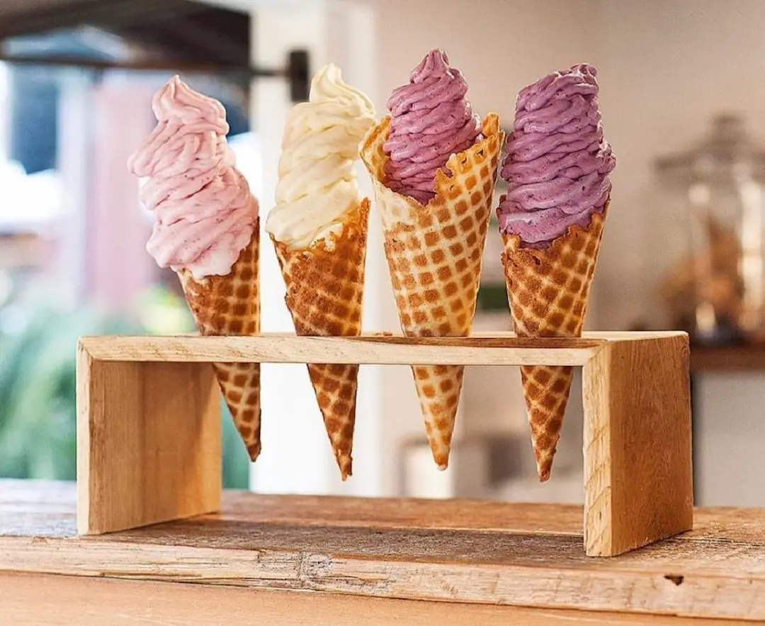 An assortment of ice cream in waffle cones at Sweet As.