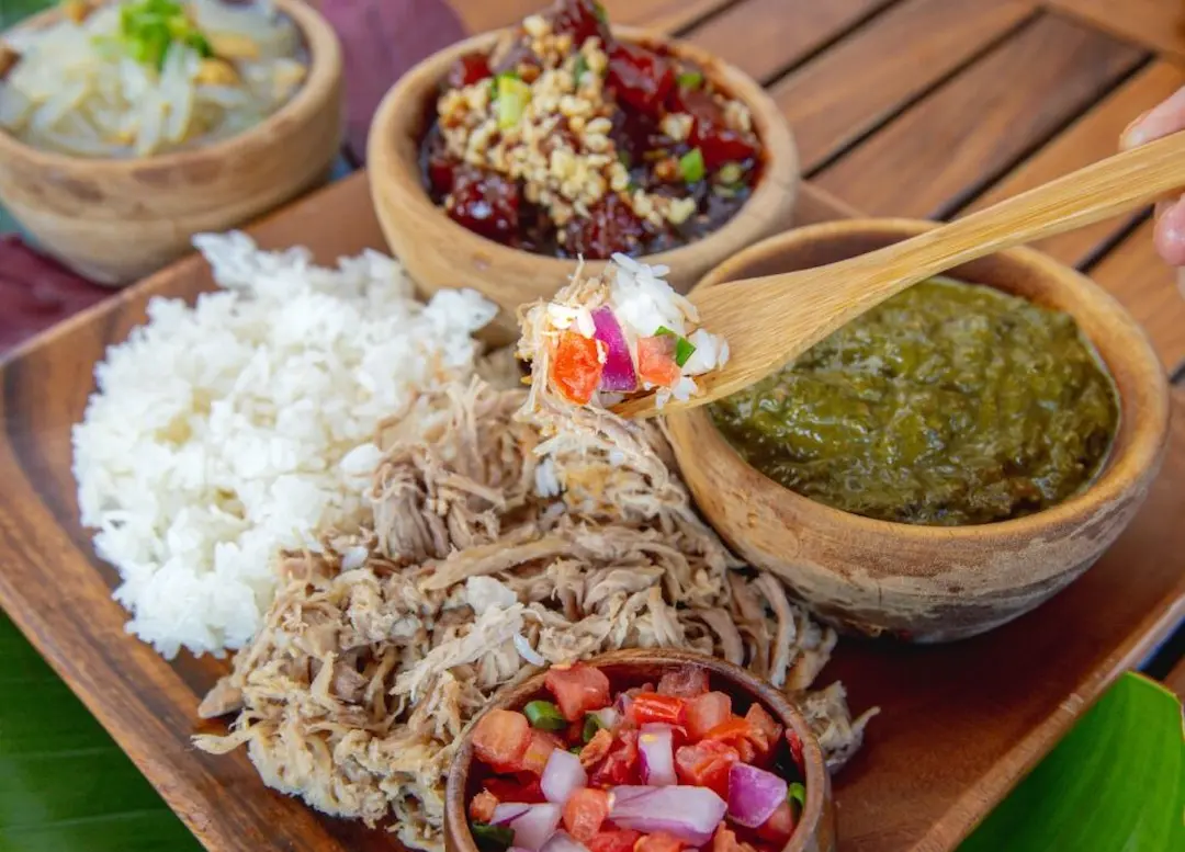 A plate of different Hawaiian dishes.