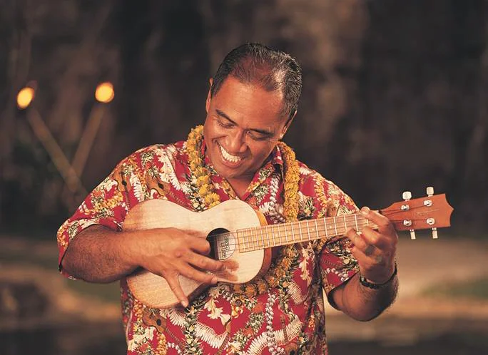 Benny Kai playing ukulele.