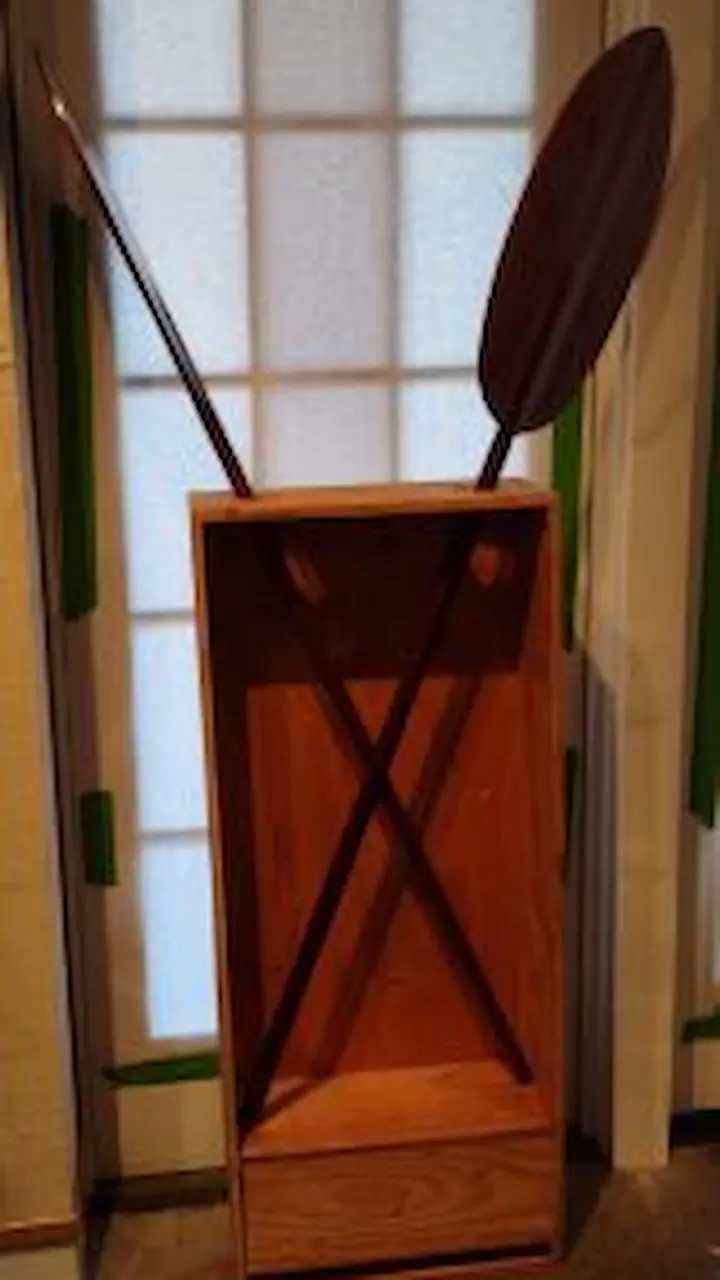 Traditional wooden oars on display.